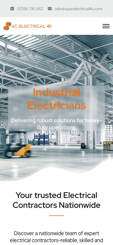 Industrial electricians working in modern warehouse environment